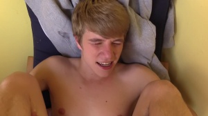 Czech boy with nice blond hair bangs in a park