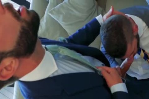 two Suited guys boning