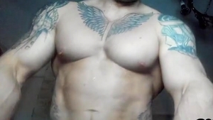 pumped up And Tattooed man Shows Off His Body And 10-Pounder